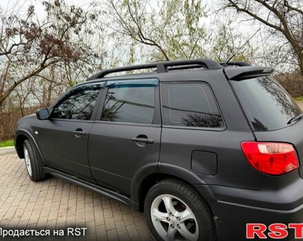 Мицубиси Аутлендер, объемом двигателя 2.4 л и пробегом 407 тыс. км за 5700 $, фото 1 на Automoto.ua