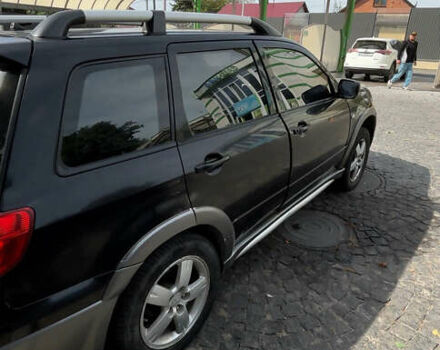 Мицубиси Аутлендер, объемом двигателя 2.4 л и пробегом 300 тыс. км за 3999 $, фото 2 на Automoto.ua