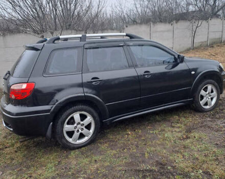 Мицубиси Аутлендер, объемом двигателя 2.4 л и пробегом 210 тыс. км за 6200 $, фото 4 на Automoto.ua