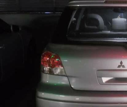 Мицубиси Аутлендер, объемом двигателя 2.4 л и пробегом 350 тыс. км за 4600 $, фото 1 на Automoto.ua