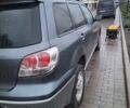 Серый Мицубиси Аутлендер, объемом двигателя 2.4 л и пробегом 286 тыс. км за 4800 $, фото 1 на Automoto.ua