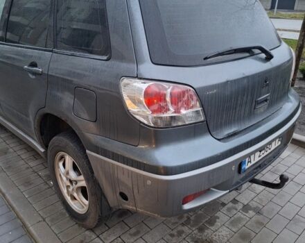 Серый Мицубиси Аутлендер, объемом двигателя 2.4 л и пробегом 286 тыс. км за 4800 $, фото 2 на Automoto.ua