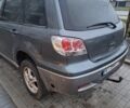 Серый Мицубиси Аутлендер, объемом двигателя 2.4 л и пробегом 286 тыс. км за 4800 $, фото 2 на Automoto.ua