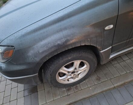 Серый Мицубиси Аутлендер, объемом двигателя 2.4 л и пробегом 286 тыс. км за 4800 $, фото 3 на Automoto.ua