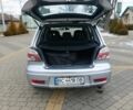 Серый Мицубиси Аутлендер, объемом двигателя 2.4 л и пробегом 238 тыс. км за 8200 $, фото 1 на Automoto.ua
