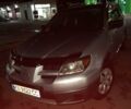 Серый Мицубиси Аутлендер, объемом двигателя 2 л и пробегом 307 тыс. км за 6800 $, фото 1 на Automoto.ua