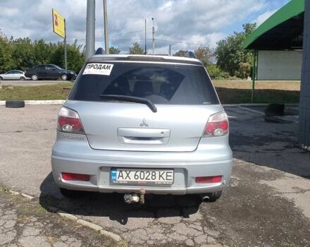 Серый Мицубиси Аутлендер, объемом двигателя 2.4 л и пробегом 230 тыс. км за 7300 $, фото 2 на Automoto.ua