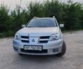 Сірий Міцубісі Аутлендер, об'ємом двигуна 2.4 л та пробігом 204 тис. км за 5600 $, фото 3 на Automoto.ua
