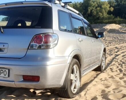 Серый Мицубиси Аутлендер, объемом двигателя 2 л и пробегом 138 тыс. км за 7600 $, фото 6 на Automoto.ua