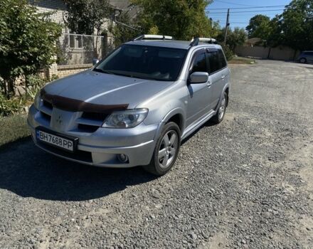 Серый Мицубиси Аутлендер, объемом двигателя 2.4 л и пробегом 291 тыс. км за 5999 $, фото 1 на Automoto.ua