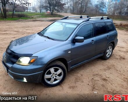 Серый Мицубиси Аутлендер, объемом двигателя 2 л и пробегом 388 тыс. км за 4500 $, фото 6 на Automoto.ua