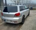 Серый Мицубиси Аутлендер, объемом двигателя 2.4 л и пробегом 250 тыс. км за 5600 $, фото 1 на Automoto.ua