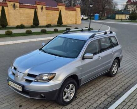 Серый Мицубиси Аутлендер, объемом двигателя 2 л и пробегом 209 тыс. км за 5800 $, фото 1 на Automoto.ua