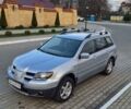 Серый Мицубиси Аутлендер, объемом двигателя 2 л и пробегом 209 тыс. км за 5800 $, фото 1 на Automoto.ua