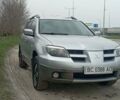 Серый Мицубиси Аутлендер, объемом двигателя 2 л и пробегом 412 тыс. км за 4800 $, фото 1 на Automoto.ua