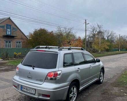 Сірий Міцубісі Аутлендер, об'ємом двигуна 2 л та пробігом 252 тис. км за 4600 $, фото 2 на Automoto.ua
