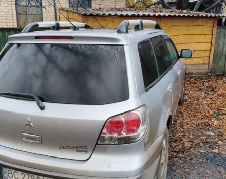 Серый Мицубиси Аутлендер, объемом двигателя 2 л и пробегом 371 тыс. км за 5700 $, фото 1 на Automoto.ua
