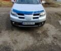 Серый Мицубиси Аутлендер, объемом двигателя 2 л и пробегом 205 тыс. км за 6000 $, фото 1 на Automoto.ua