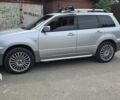 Серый Мицубиси Аутлендер, объемом двигателя 2 л и пробегом 300 тыс. км за 7000 $, фото 1 на Automoto.ua