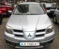 Серый Мицубиси Аутлендер, объемом двигателя 2.4 л и пробегом 255 тыс. км за 5353 $, фото 1 на Automoto.ua