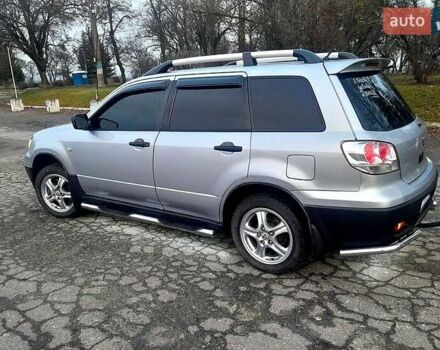 Серый Мицубиси Аутлендер, объемом двигателя 2 л и пробегом 400 тыс. км за 5000 $, фото 7 на Automoto.ua