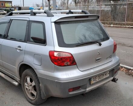 Серый Мицубиси Аутлендер, объемом двигателя 2 л и пробегом 240 тыс. км за 3900 $, фото 5 на Automoto.ua