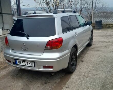 Серый Мицубиси Аутлендер, объемом двигателя 2.4 л и пробегом 250 тыс. км за 5600 $, фото 1 на Automoto.ua