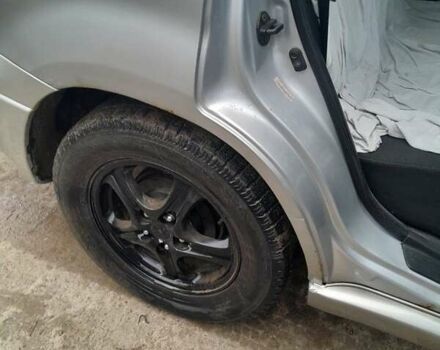 Серый Мицубиси Аутлендер, объемом двигателя 2.4 л и пробегом 250 тыс. км за 5600 $, фото 2 на Automoto.ua