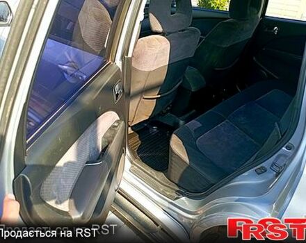 Серый Мицубиси Аутлендер, объемом двигателя 2 л и пробегом 280 тыс. км за 5500 $, фото 4 на Automoto.ua