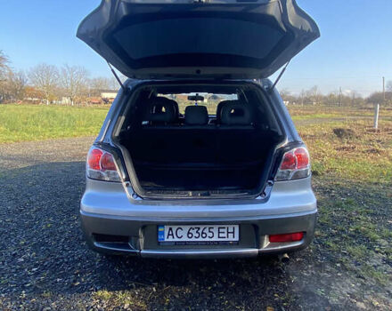 Серый Мицубиси Аутлендер, объемом двигателя 2 л и пробегом 250 тыс. км за 5700 $, фото 4 на Automoto.ua