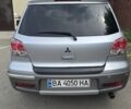 Серый Мицубиси Аутлендер, объемом двигателя 2 л и пробегом 300 тыс. км за 7000 $, фото 3 на Automoto.ua