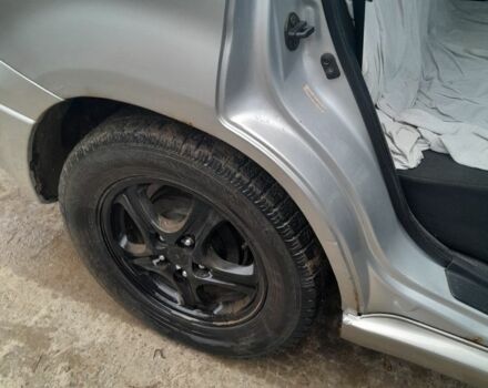 Серый Мицубиси Аутлендер, объемом двигателя 2.4 л и пробегом 250 тыс. км за 5600 $, фото 4 на Automoto.ua