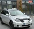 Серый Мицубиси Аутлендер, объемом двигателя 2.38 л и пробегом 300 тыс. км за 4800 $, фото 1 на Automoto.ua