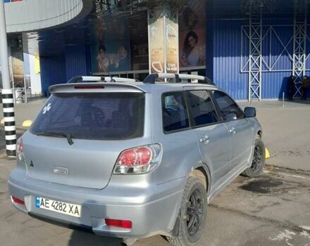Серый Мицубиси Аутлендер, объемом двигателя 2 л и пробегом 320 тыс. км за 7300 $, фото 4 на Automoto.ua