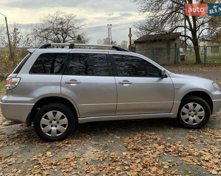 Серый Мицубиси Аутлендер, объемом двигателя 2 л и пробегом 239 тыс. км за 5800 $, фото 8 на Automoto.ua