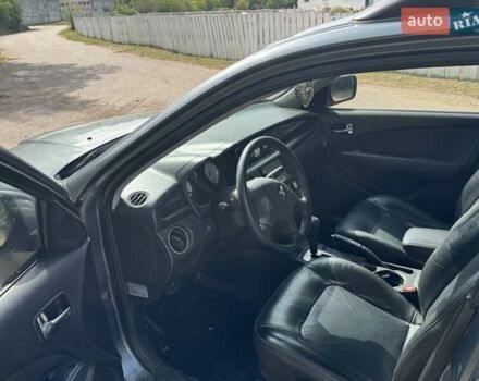 Серый Мицубиси Аутлендер, объемом двигателя 2.4 л и пробегом 276 тыс. км за 6299 $, фото 5 на Automoto.ua