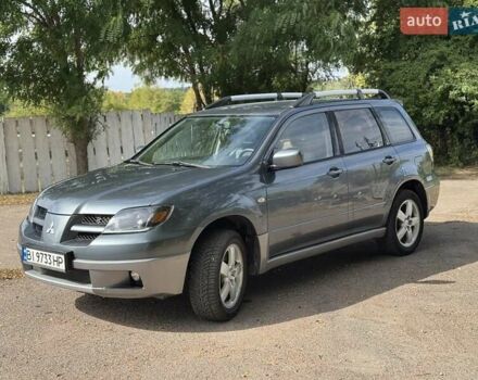 Серый Мицубиси Аутлендер, объемом двигателя 2.4 л и пробегом 276 тыс. км за 6299 $, фото 1 на Automoto.ua