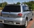 Серый Мицубиси Аутлендер, объемом двигателя 2.4 л и пробегом 280 тыс. км за 6000 $, фото 1 на Automoto.ua