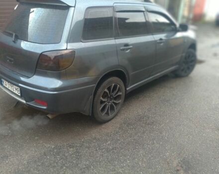 Серый Мицубиси Аутлендер, объемом двигателя 2.4 л и пробегом 286 тыс. км за 7400 $, фото 2 на Automoto.ua