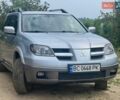 Серый Мицубиси Аутлендер, объемом двигателя 2.38 л и пробегом 171 тыс. км за 7000 $, фото 1 на Automoto.ua