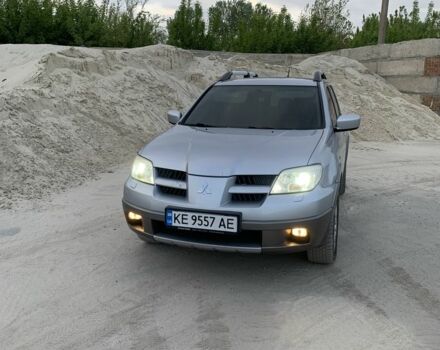 Серый Мицубиси Аутлендер, объемом двигателя 2.4 л и пробегом 229 тыс. км за 4850 $, фото 2 на Automoto.ua