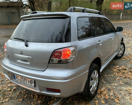 Серый Мицубиси Аутлендер, объемом двигателя 2 л и пробегом 239 тыс. км за 5800 $, фото 7 на Automoto.ua