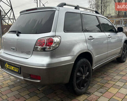 Серый Мицубиси Аутлендер, объемом двигателя 2.38 л и пробегом 256 тыс. км за 6700 $, фото 6 на Automoto.ua
