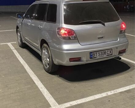 Серый Мицубиси Аутлендер, объемом двигателя 2.4 л и пробегом 285 тыс. км за 4600 $, фото 2 на Automoto.ua