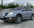 Сірий Міцубісі Аутлендер, об'ємом двигуна 2.4 л та пробігом 229 тис. км за 5800 $, фото 1 на Automoto.ua