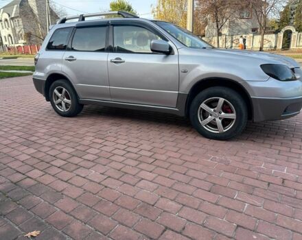 Серый Мицубиси Аутлендер, объемом двигателя 2.4 л и пробегом 221 тыс. км за 5550 $, фото 4 на Automoto.ua