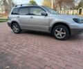 Серый Мицубиси Аутлендер, объемом двигателя 2.4 л и пробегом 221 тыс. км за 5550 $, фото 4 на Automoto.ua