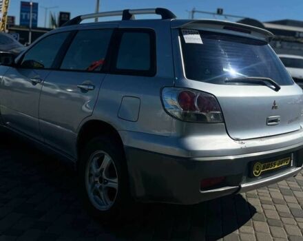 Серый Мицубиси Аутлендер, объемом двигателя 2.4 л и пробегом 240 тыс. км за 5700 $, фото 4 на Automoto.ua