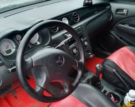 Серый Мицубиси Аутлендер, объемом двигателя 2.38 л и пробегом 255 тыс. км за 6000 $, фото 2 на Automoto.ua