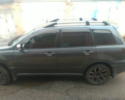 Серый Мицубиси Аутлендер, объемом двигателя 2.4 л и пробегом 286 тыс. км за 7400 $, фото 3 на Automoto.ua